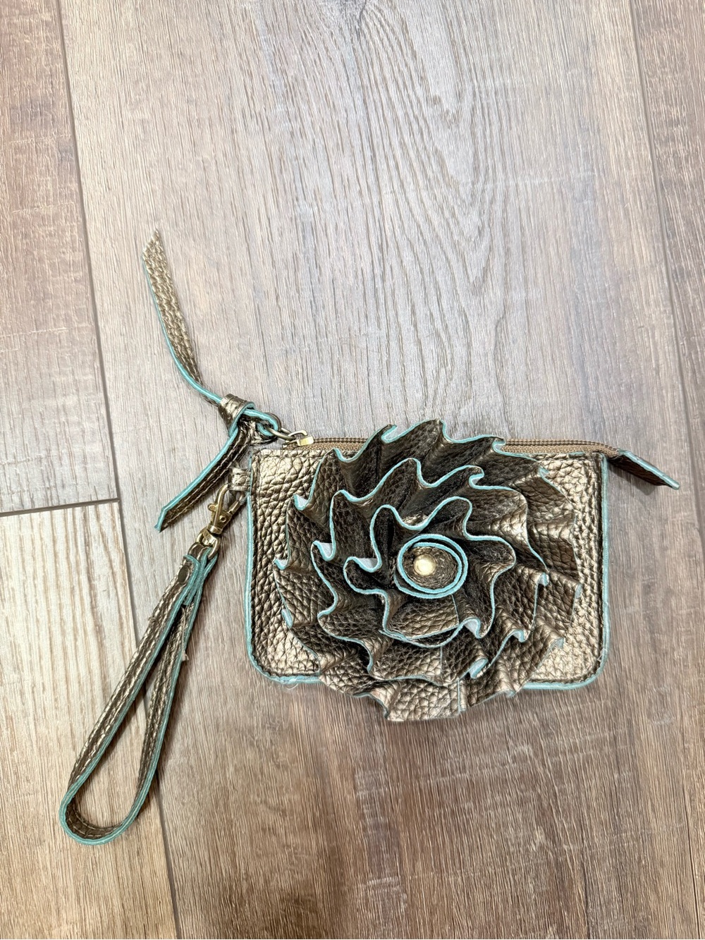 Jazzed brand flower bronze wristlet